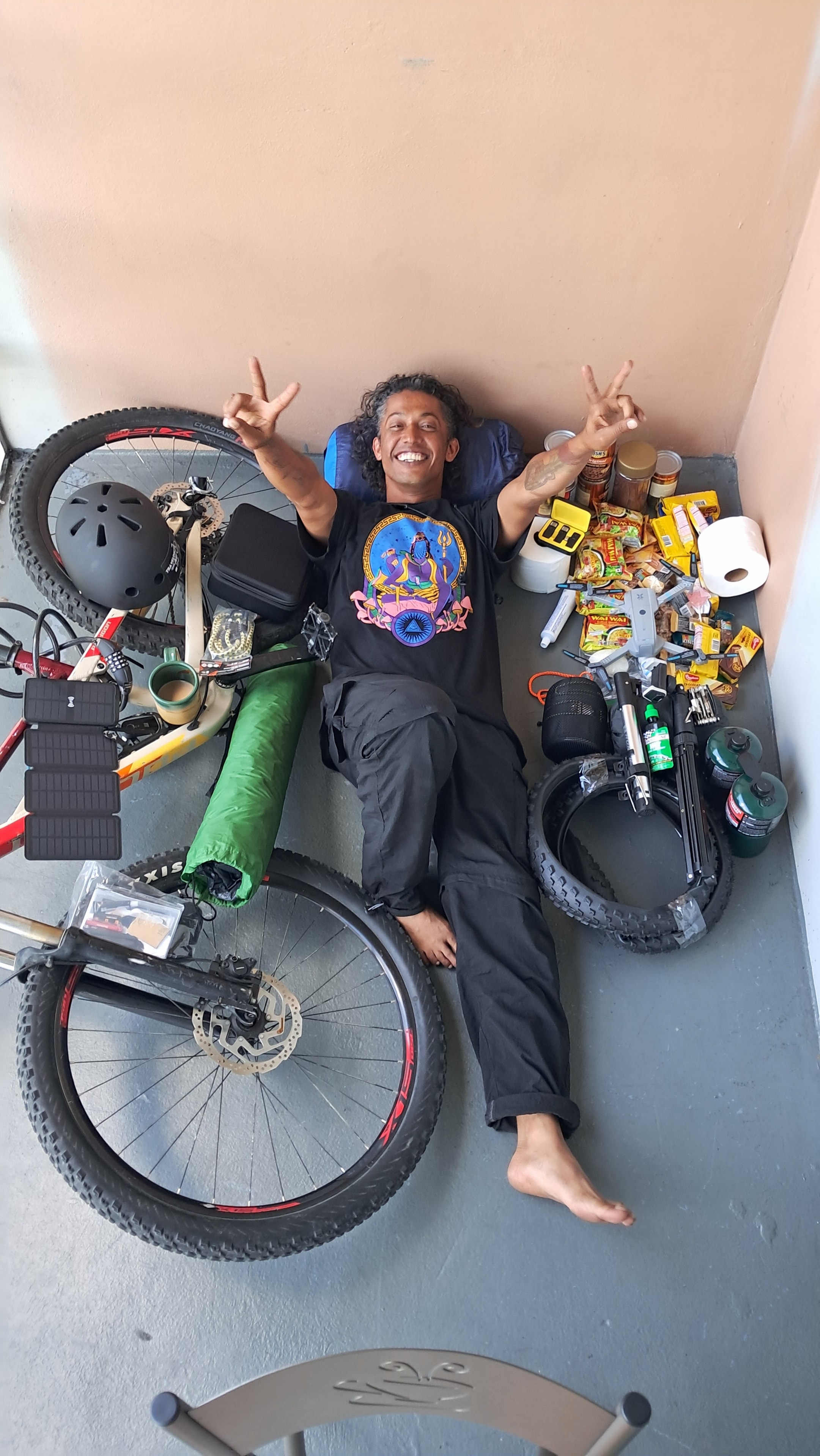 Overhead flat-lay of camping and cycling gear